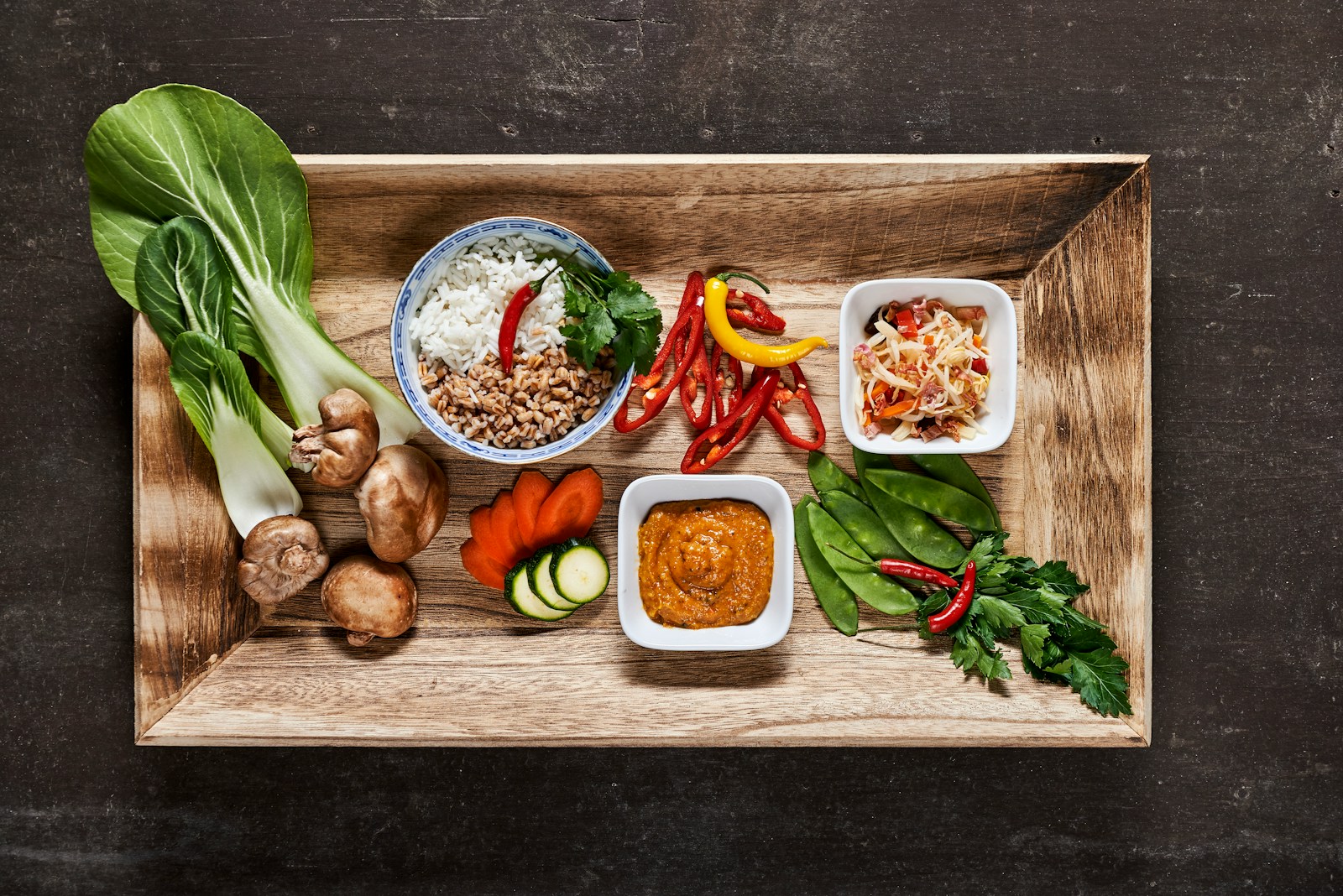 vegetable salad on brown wooden tray