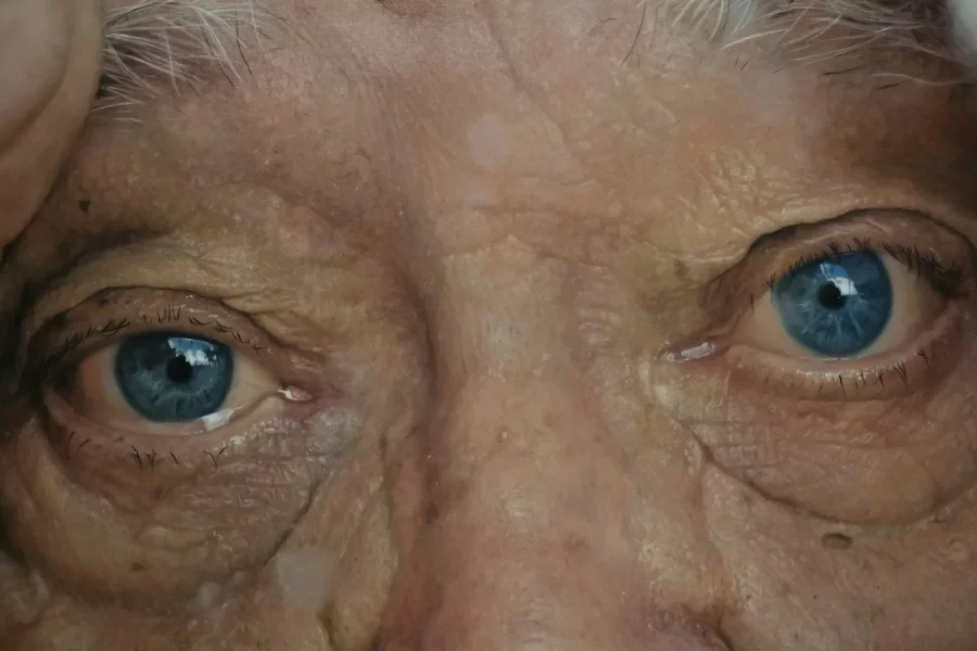 Close-up of an elderly person's blue eyes.